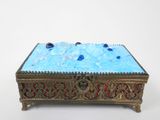 an image of a decorative box with blue glass beads on it