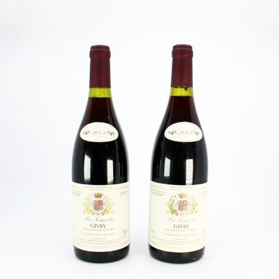 two bottles of red wine sitting next to each other on a white surface