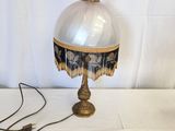 an image of a table lamp with a glass shade on it