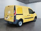 a yellow van that is parked in a room