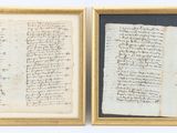 two framed manuscripts, one of which has been written by a man