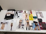 a lot of magazines on a table with a woman ' s underwear
