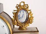 a clock with a picture of a man and a woman on it