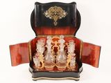 a black and gold case with a set of wine glasses in it