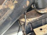 a close up of a motorcycle engine with a chain