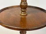 a wooden table with a vase on top of it