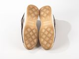 the soles of a pair of shoes on a white surface