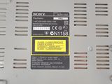 a close up of a sony power supply with a yellow sticker on it