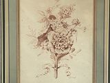 tableau représentant un bouquet de fleurs dans un cadre accroché au mur