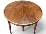 an image of a round table with a wooden top and legs