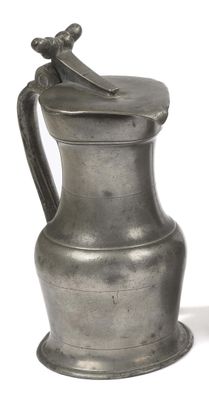 a silver pitcher with a handle on a white background