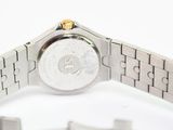 a close up of a wrist watch on a white surface