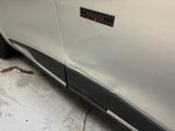a close up of a car door with a sticker on it