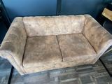 a couch that is sitting on the floor in a room