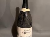 a bottle of wine that is sitting on a table