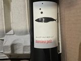 a bottle of wine that is sitting on a box