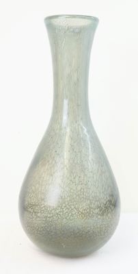 a glass vase that is sitting on a table