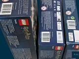 two boxes of legos that are sitting side by side