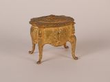 an image of a small gold box with a lid on a white background
