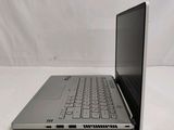 an open laptop computer sitting on top of a white table