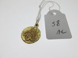 a close up of a gold coin on a string with a price tag
