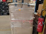 a large cart with a lot of boxes on it in a warehouse