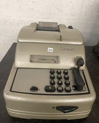 an old typewriter sitting on a table in a room