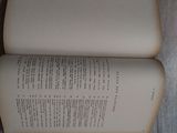 an open book sitting on a wooden table