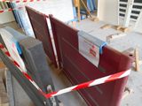 a red barrier that is in the middle of a construction site