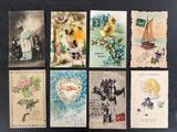 many cards with pictures of people on them on a table