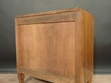 an image of a small wooden chest sitting on top of a carpeted floor
