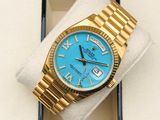 gold rolex watch with blue dial and roman numerals