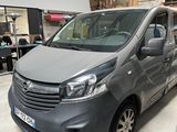 the van is parked in the garage in front of other cars