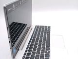 two laptops sitting side by side on a white surface