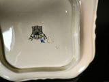 a close up of a white plate with a picture of a castle on it