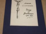 une image représentant un livre sur lequel est posée une statue