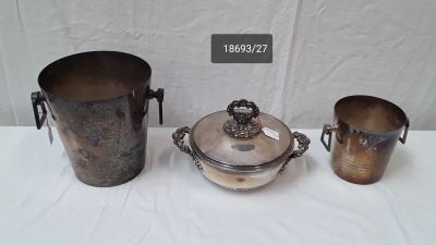 three metal buckets sitting on top of a table next to each other