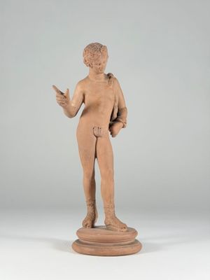 statue of a boy with a book in his hands