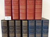 six books are stacked on top of each other on a white surface