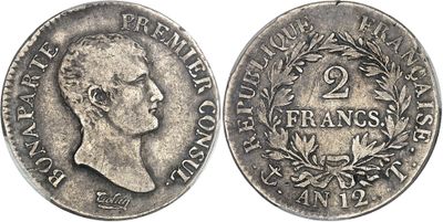 a silver coin with a portrait of a man on it
