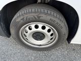 a tire that is sitting on the side of the road