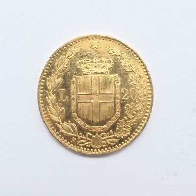l'image d'une pièce d'or sur laquelle figurent des armoiries