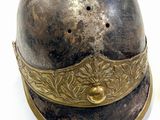 a helmet and a knife sitting on a table