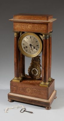 a wooden clock that is sitting on a table