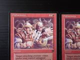 two cards that are sitting on a table