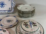 many plates that are sitting on a table
