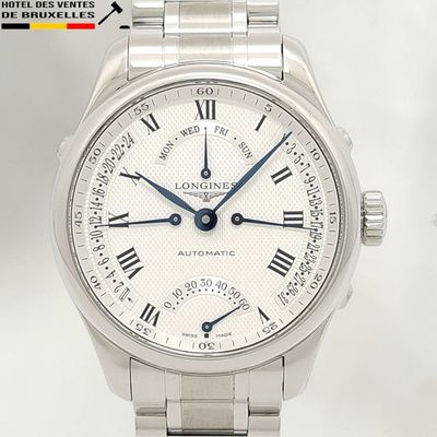 a close up of a wrist watch with roman numerals