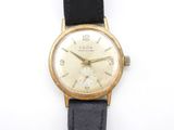 an image of a close up of a wrist watch on a white surface