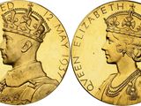 a gold sovereign coin with a crown on it