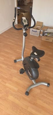 a stationary exercise bike in the corner of a room